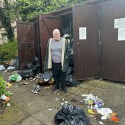 Mandy Gibb at the overflowing bin store