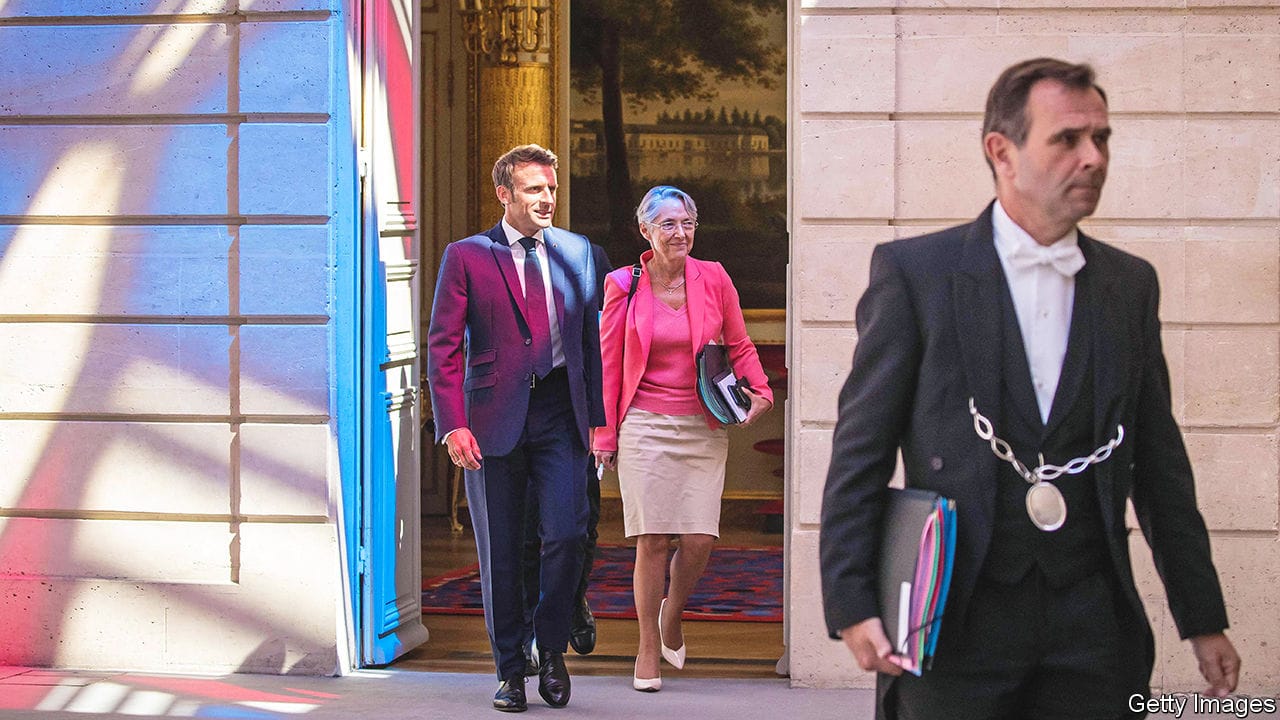 French President Emmanuel Macron (C,L) and Prime Minister Elisabeth Borne (C,R) arrive for the first cabinet meeting of the newly reshuffled government at the Elysee Palace in Paris, on July 4, 2022. (Photo by Christophe PETIT TESSON / POOL / AFP) (Photo by CHRISTOPHE PETIT TESSON/POOL/AFP via Getty Images)