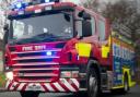 Fire crews rescued two people from a car when it got stuck in a ford on Earls Common Road