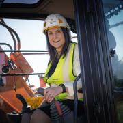 Alison Hernandez in a digger