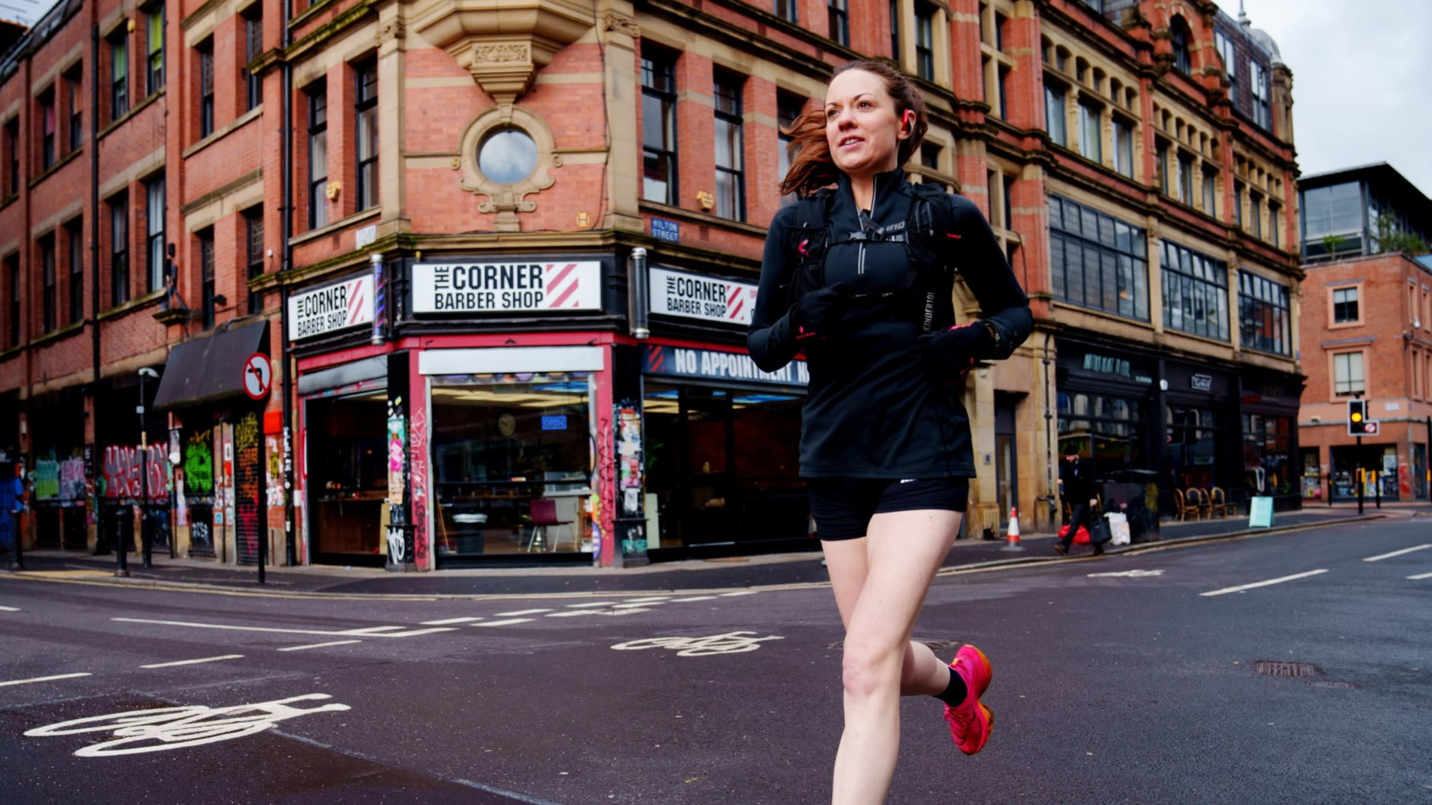 Clair Heaviside makes her way through Manchester’s Northern Quarter as she arrives at work after a running commute from her home in Disley 13 miles away