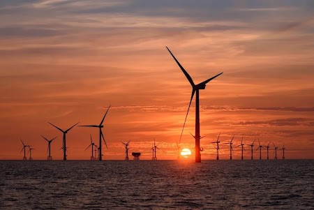 Offshore windmills at sunset