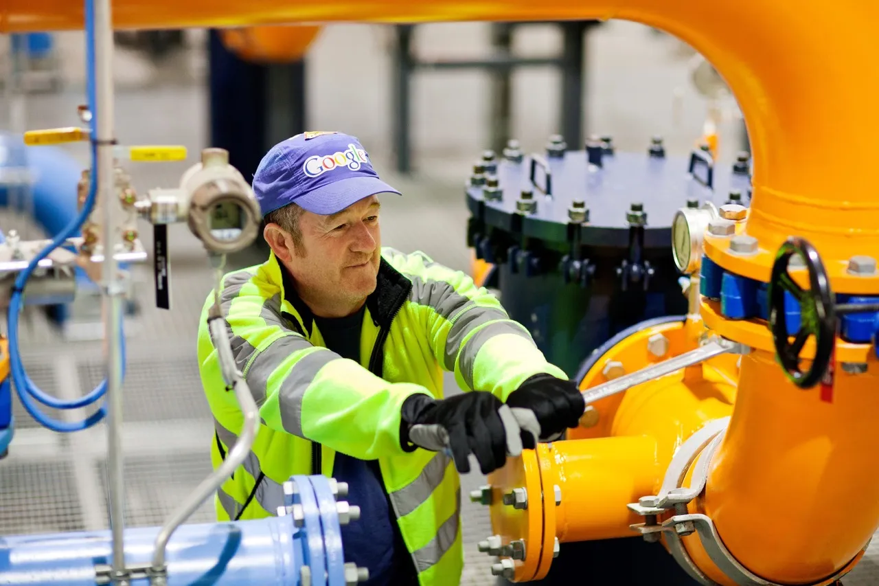 A worker tightens a valve coupling in our Hamina, Finland data center