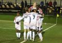 Hereford players celebrate the game’s only goal as they beat Rushall Olympic 1-0