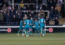 Chorley players celebrate Jack Hazelhurst’s 16th minute winner in front of the Meadow End