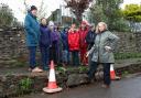 Zoe McLean (front right) and other Cusop residents next to dangerous road edging along Cusop Dingle.