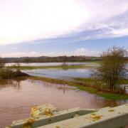 Flooding over the meadows on the edge of Hereford, pictured from Outfall Works Road