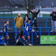 Curzon Ashton players celebrate Jimmy Spencer’s late winner against Hereford