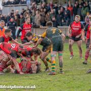 Ollie Hutcheson presents the ball while Connor Sullivan and Dean Powell direct operations for Hereford