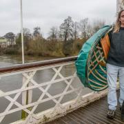 Pete Reddings with his coracle by the river Wye in Hereford