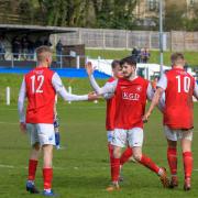 Hereford Pegasus celebrate a 5-1 away victory at Brinscombe & Thrupp