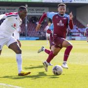 Hereford goal scorer Tope Obadeyi takes on his marker against Scunthorpe United