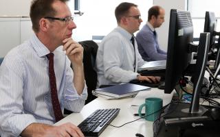 Editor John Wilson, front, at work in the Hereford Times newsroom