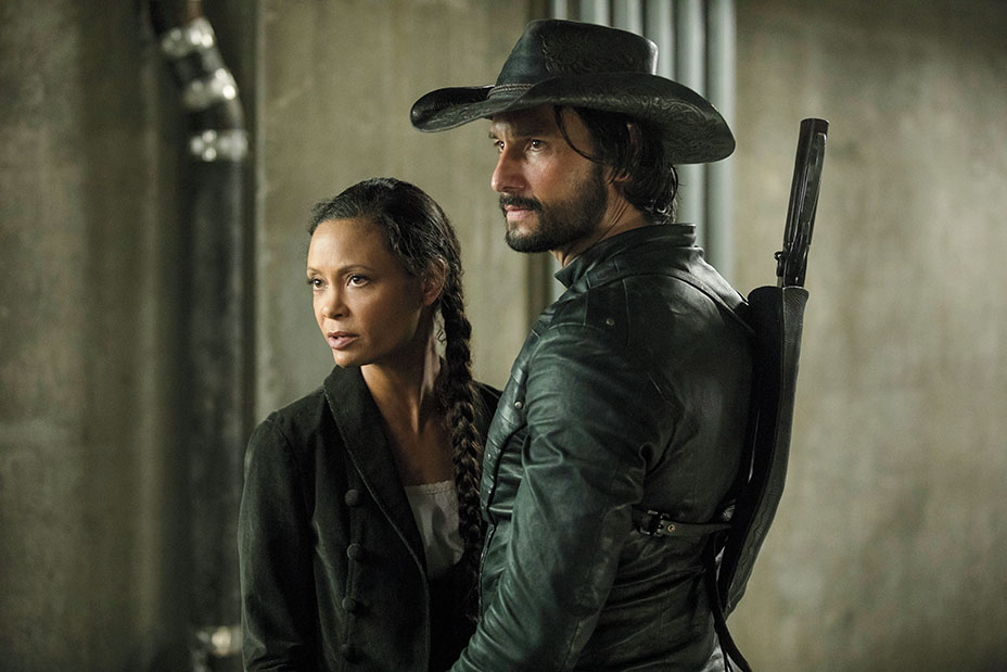 Atmospheric shot from the TV Show "Westworld," characters Maeve Millay and Hector Escaton are portrayed in a contemplative moment.