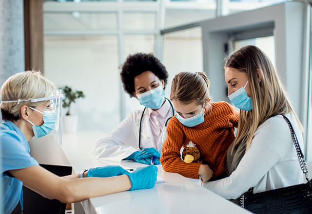 mom checks child into the hospital