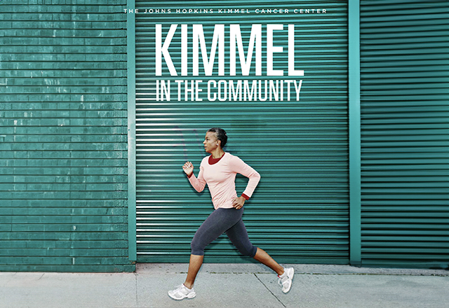 Healthy woman running with green wall behind her