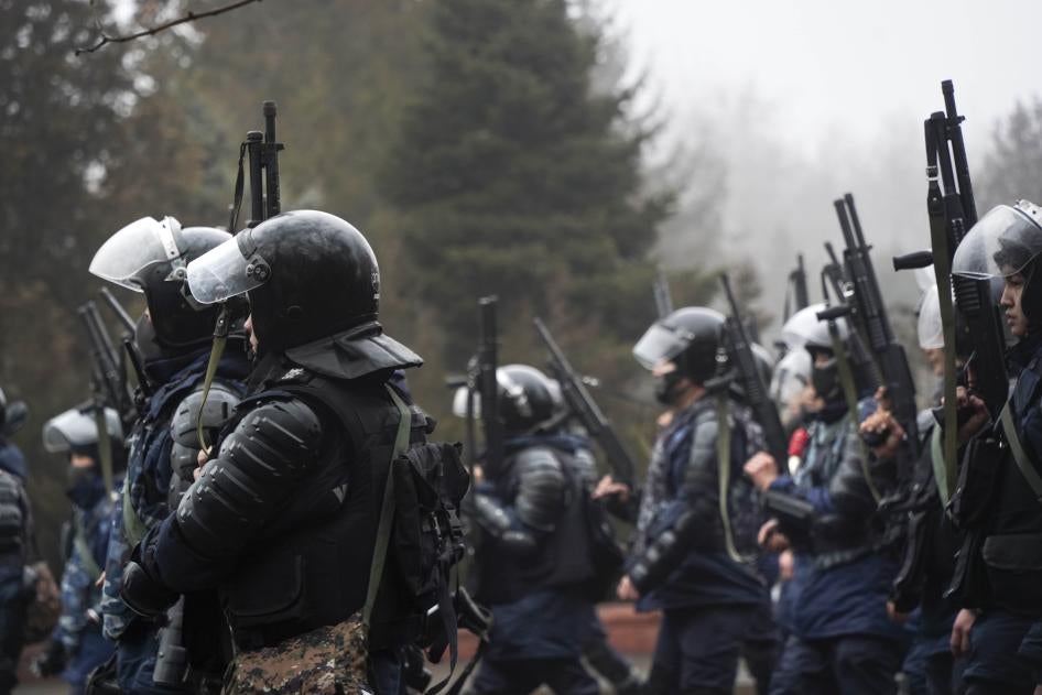 Riot police officers holding 12-gauge shotguns, which can fire both lethal and less-lethal ammunition, in Almaty, Kazakhstan, on Wednesday, Jan. 5, 2022.