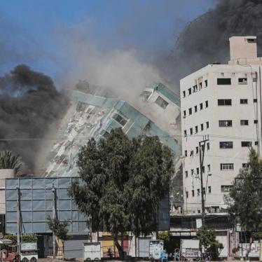 The Jala Tower as it is destroyed in an Israeli airstrike in Gaza. Israel's air force targeted the 13-floor Jala Tower housing Qatar-based Al-Jazeera television and the Associated Press news agency.