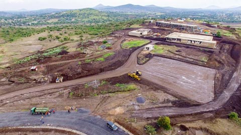 As the interior fit-out of the buildings continues, the earthworks for the parking lot, the internal road, and the perimeter fence have began.