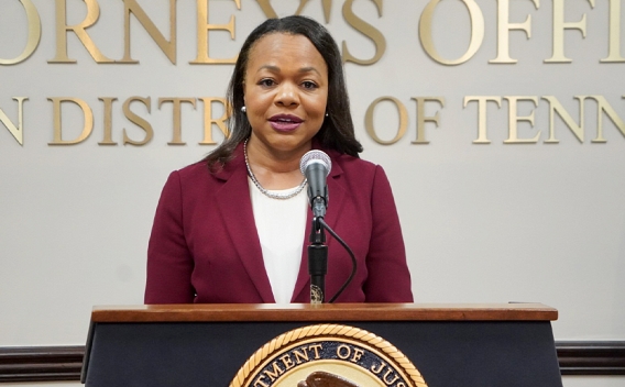 Assistant Attorney General for Civil Rights Kristen Clarke delivers remarks from a podium at the U.S. Attorney’s Office for the Western District of Tennessee.