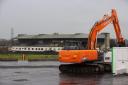 Contractors with excavators have begun clearing the concrete seating terraces at GAA stadium in Belfast, Northern Ireland, ahead of the long-delayed redevelopment of the stadium. The maintenance and pre-enabling works will run until April, when the