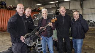 Reunited - Police hand back the irreplaceable guitar to Dr Feel good bass player Phil Mitchell alongside drummer Kevin Morris and tour manager Nic Clacy