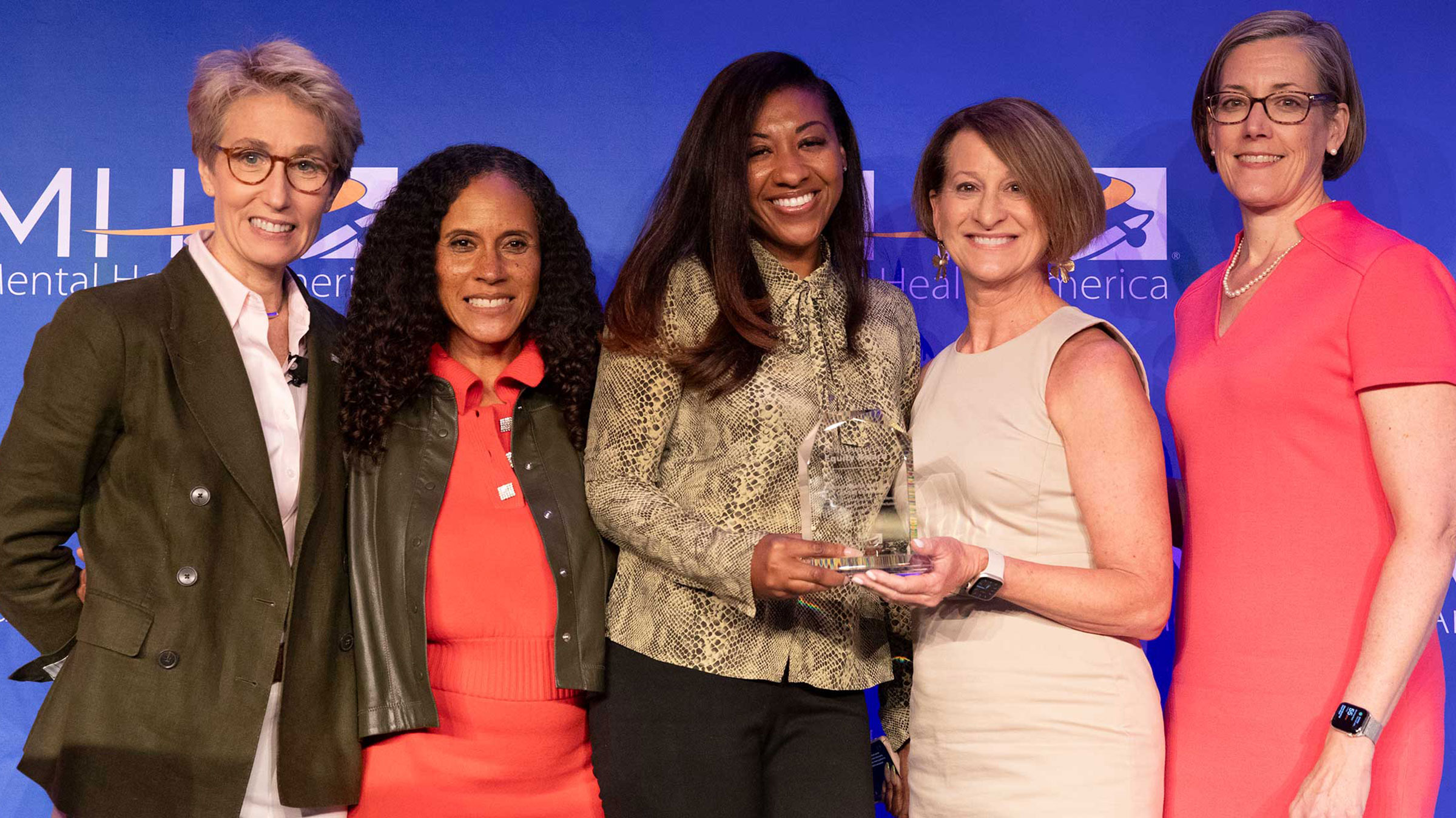 MHA CEO and Board chair stand with award recipients at 2023 Conference