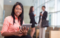 woman holding an ipad in the foreground