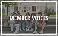 Students sitting on steps at a college.