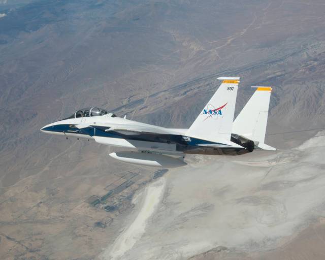 NASA photographer Jim Ross, flying with research pilot Nils Larson in F-15D #884, took this photograph of F-15D #897 with Troy A