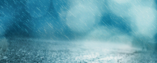 Photo of rain on pavement with blue background