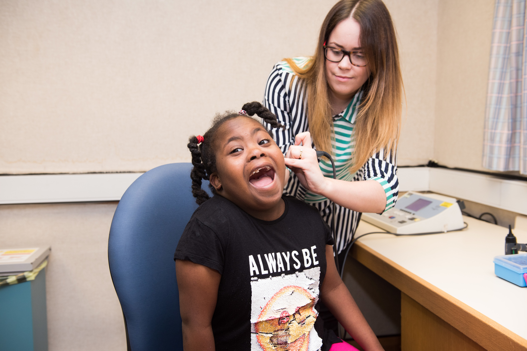 Audiologist Looking in Child's Ear 