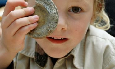 little boy with fossil