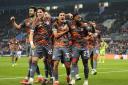 Santiago Hezze (centre) celebrates with his Olympiacos team-mates after scoring their fourth goal (Nick Potts/PA)