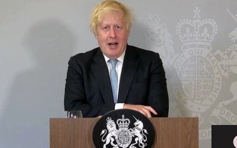 Prime Minister Boris Johnson speaks from Chequers, while self-isolating, at a Downing Street press conference on 19 July 2021