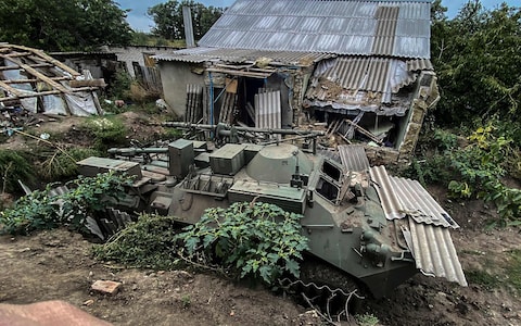 An abandoned Russian tank near a village on the outskirts of Izyum, Kharkiv region
