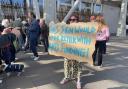 A protester calling on the Scottish Government to reinstate £6.6 million of Creative Scotland funding