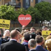 Supporters hold placards as they attend the final general election campaign rally of Scotland's First Minister and leader of the Scottish National Party Nicola Sturgeon on June 7, 2017, in Edinburgh, Scotland..Britain on June 7 headed into the final