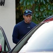 Tiger Woods gets into a vehicle after withdrawing from the Genesis Invitational golf tournament at Riviera Country Club (Ryan Sun/AP)