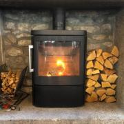 Logs burn on a wood burning stove