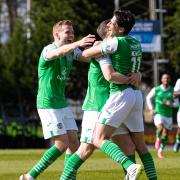 The Hibs players celebrate making it 2-0