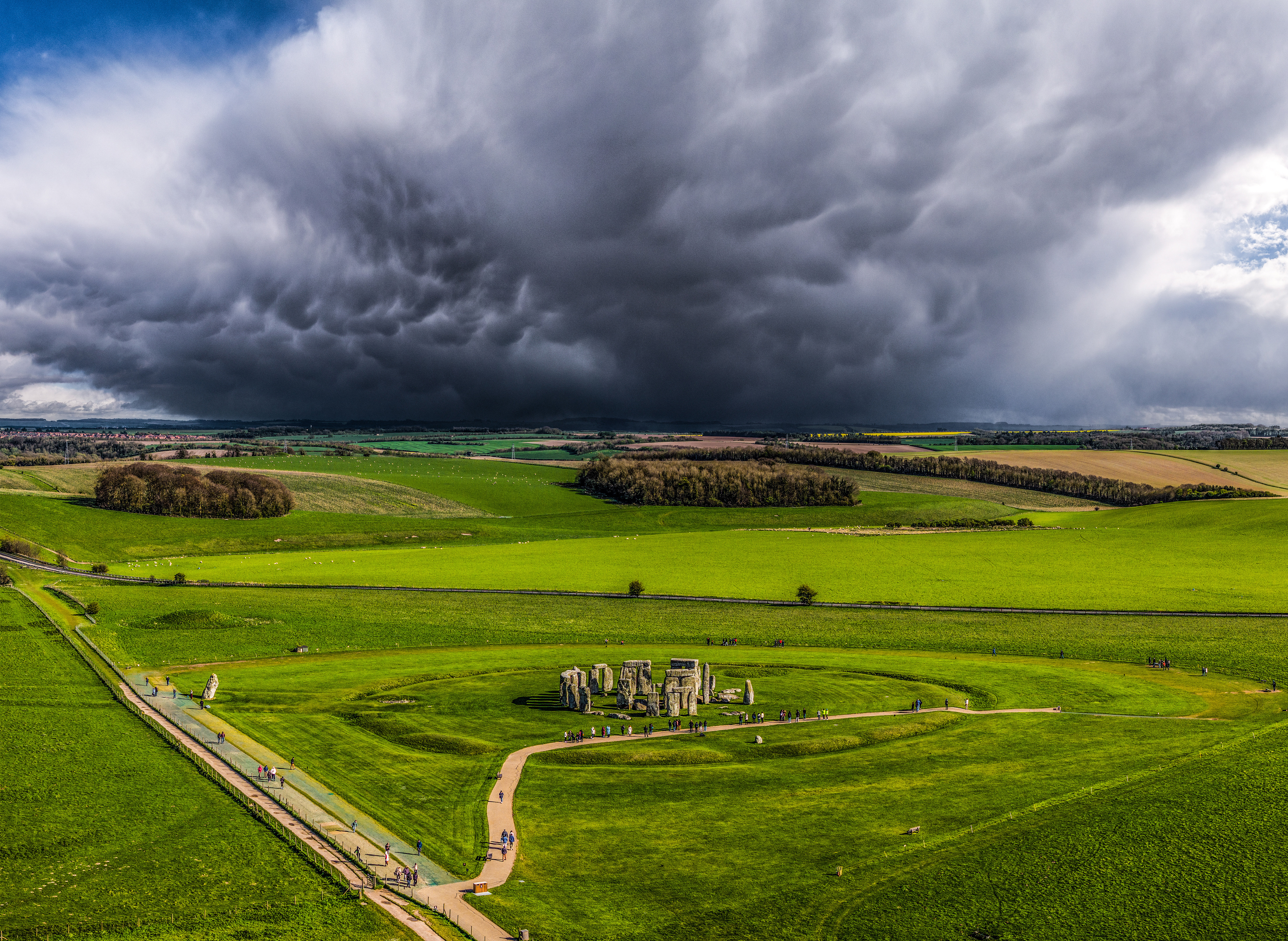 Storm clouds cast a long shadow over Stonehenge on Salisbury Plain, Wiltshire