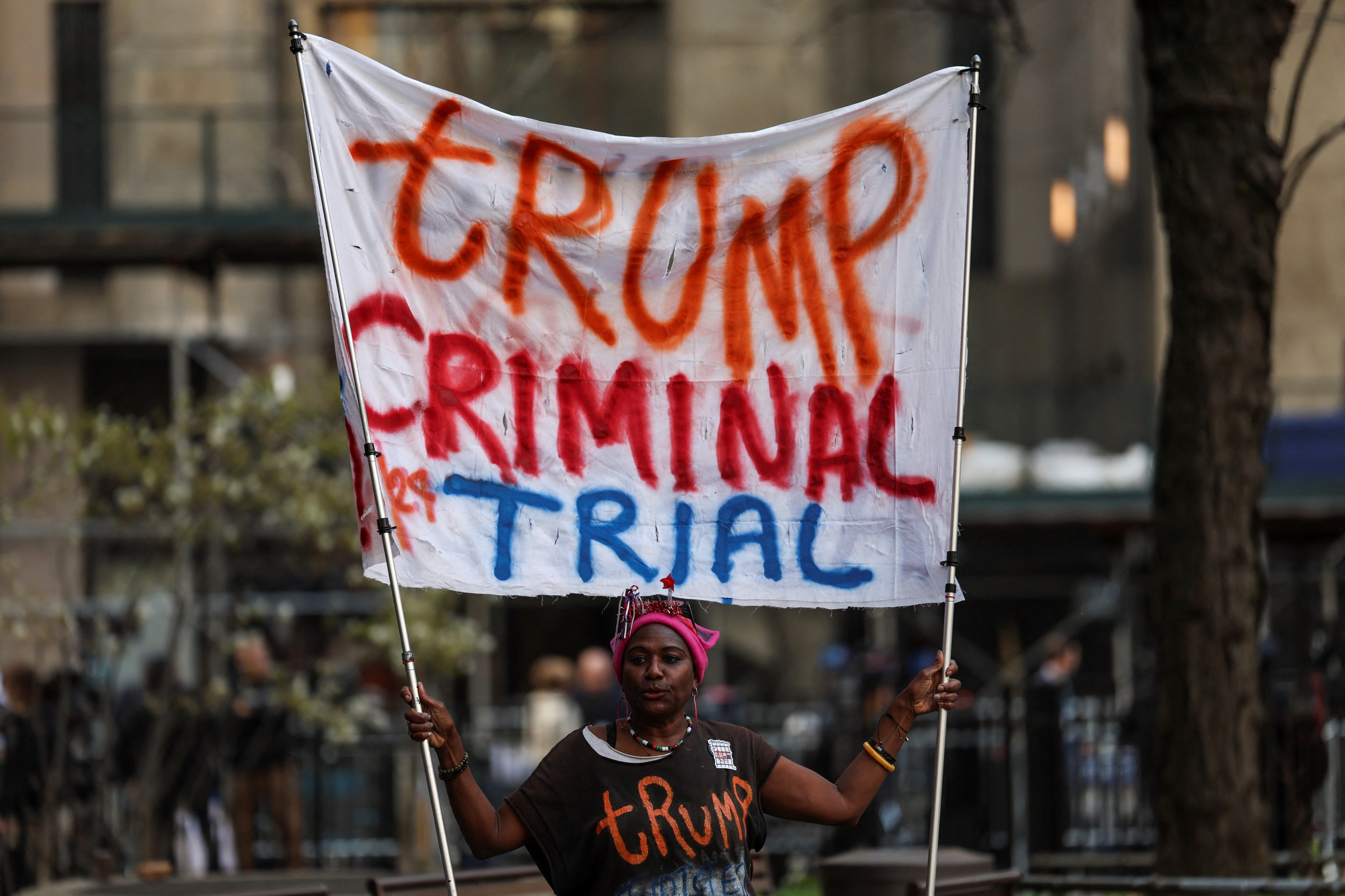 A protester stands outside the courthouse in New York ahead of Donald Trump’s trial