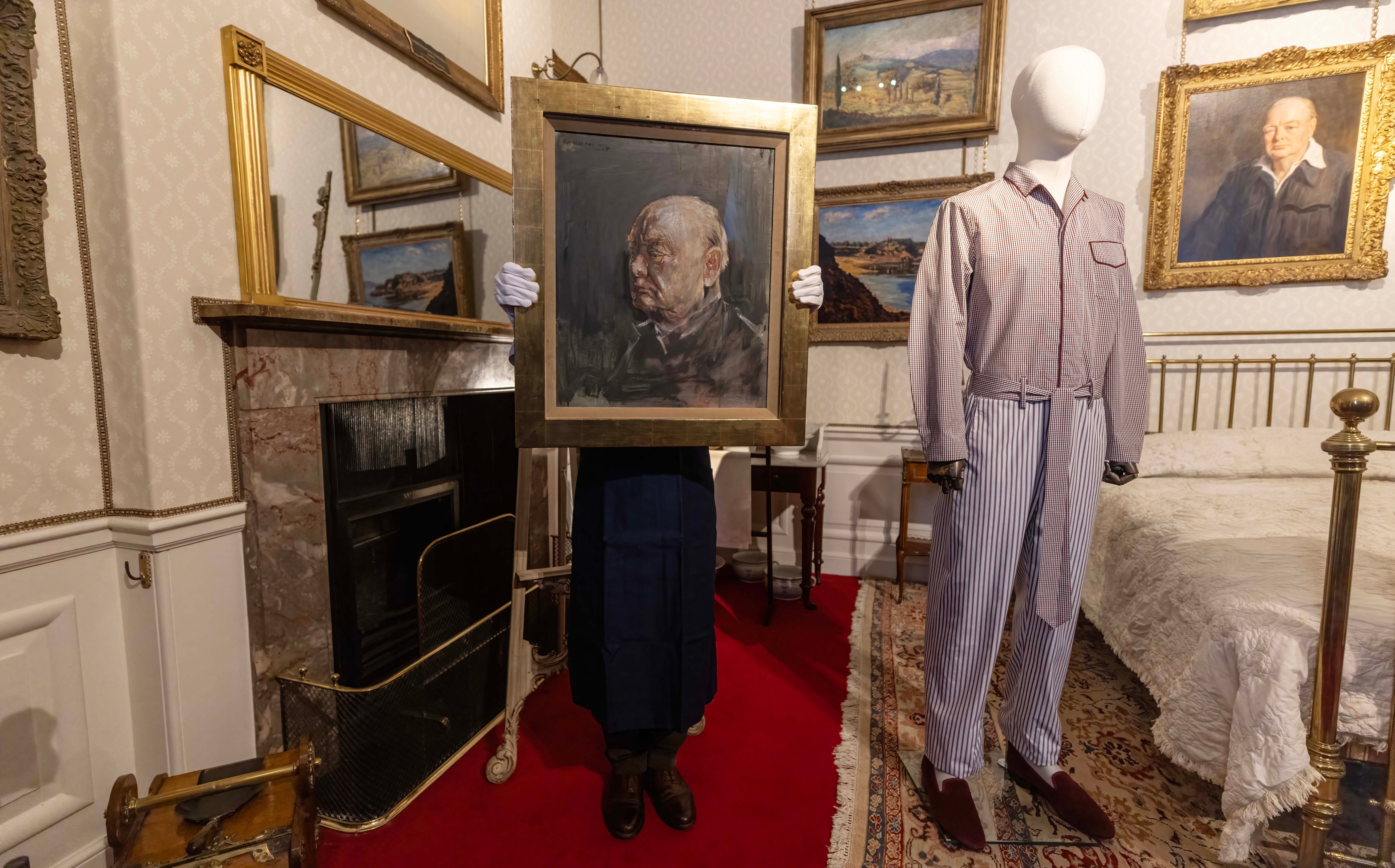 A Sotheby’s art handler with the best surviving portrait of Sir Winston Churchill by Graham Sutherland in the room at Blenheim Palace where the former prime minister was born. The painting is to be auctioned in June with an estimated value of between £500,000 and £800,000