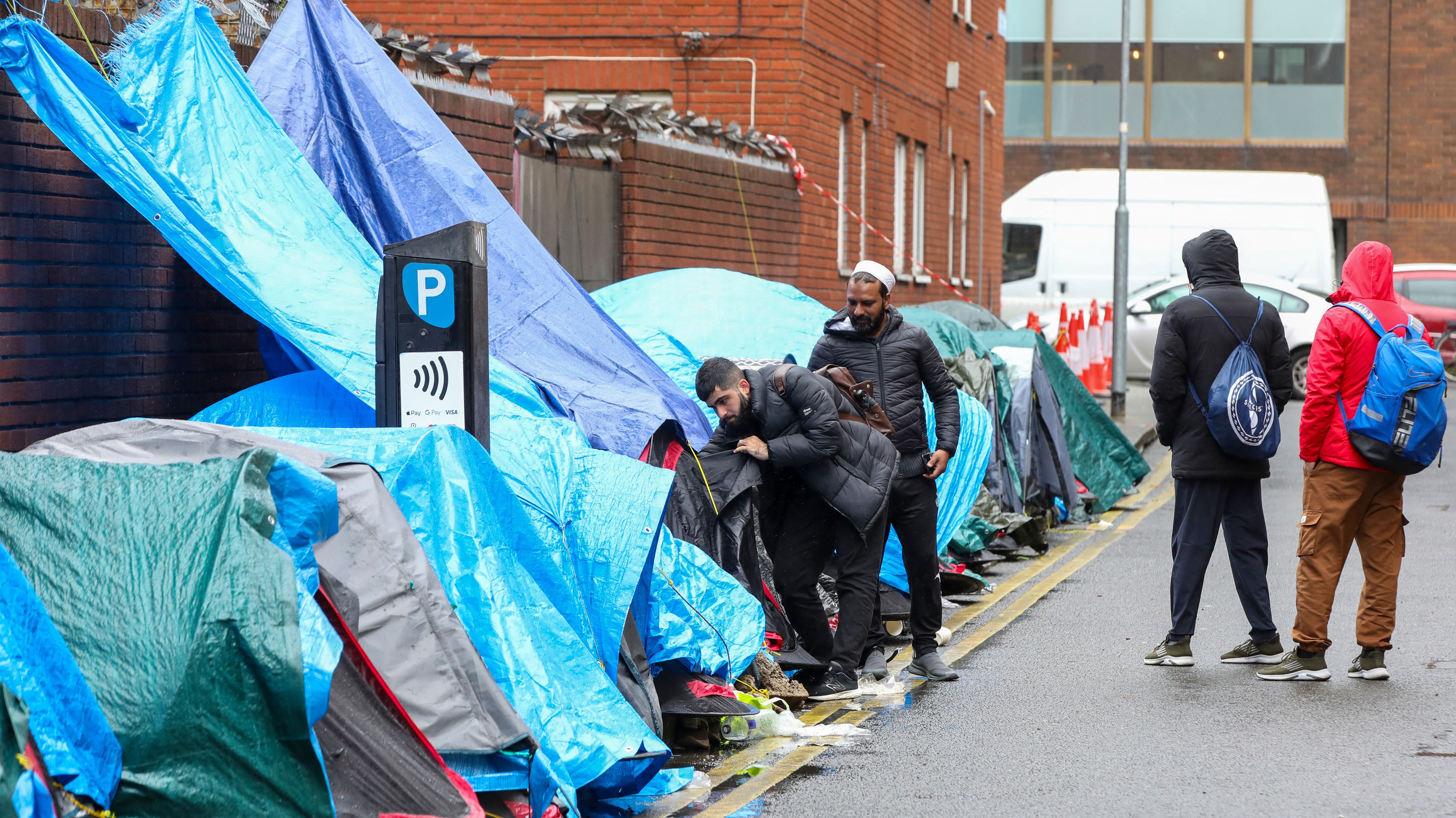 The Irish authorities dismantled a tent village housing more than 200 asylum seekers outside a government office in Dublin