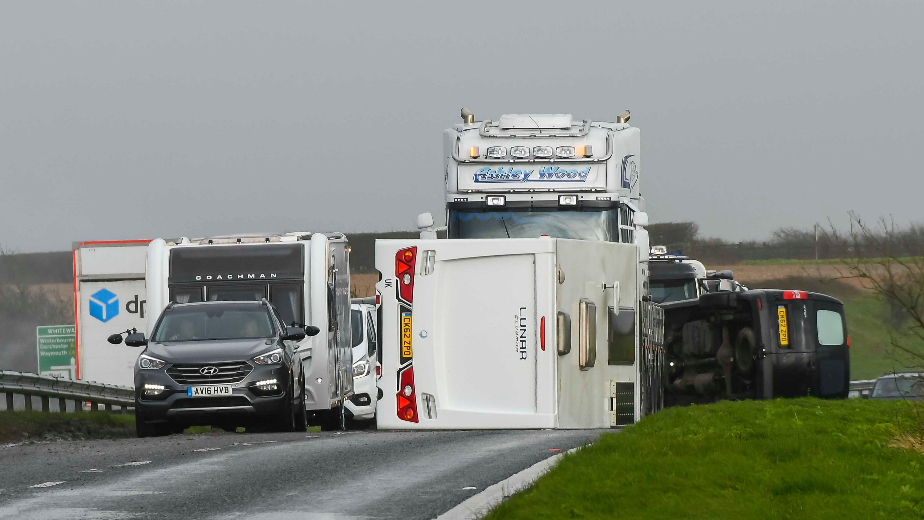 A van towing a caravan was blown over by gale force winds from Storm Nelson, blocking one lane of the A35 at Litton Cheney in Dorset
