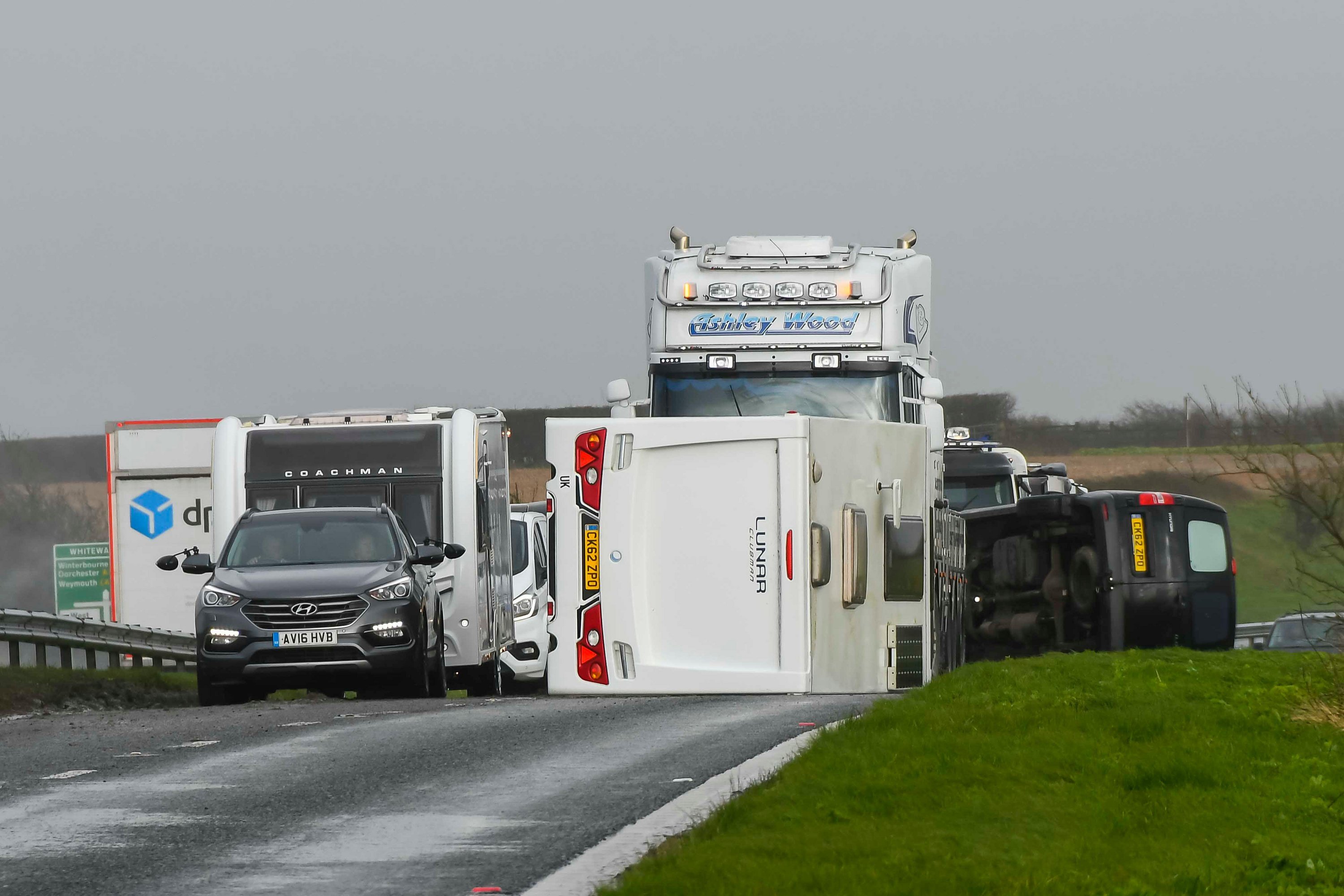 A van towing a caravan was blown over by gale force winds from Storm Nelson, blocking one lane of the A35 at Litton Cheney in Dorset