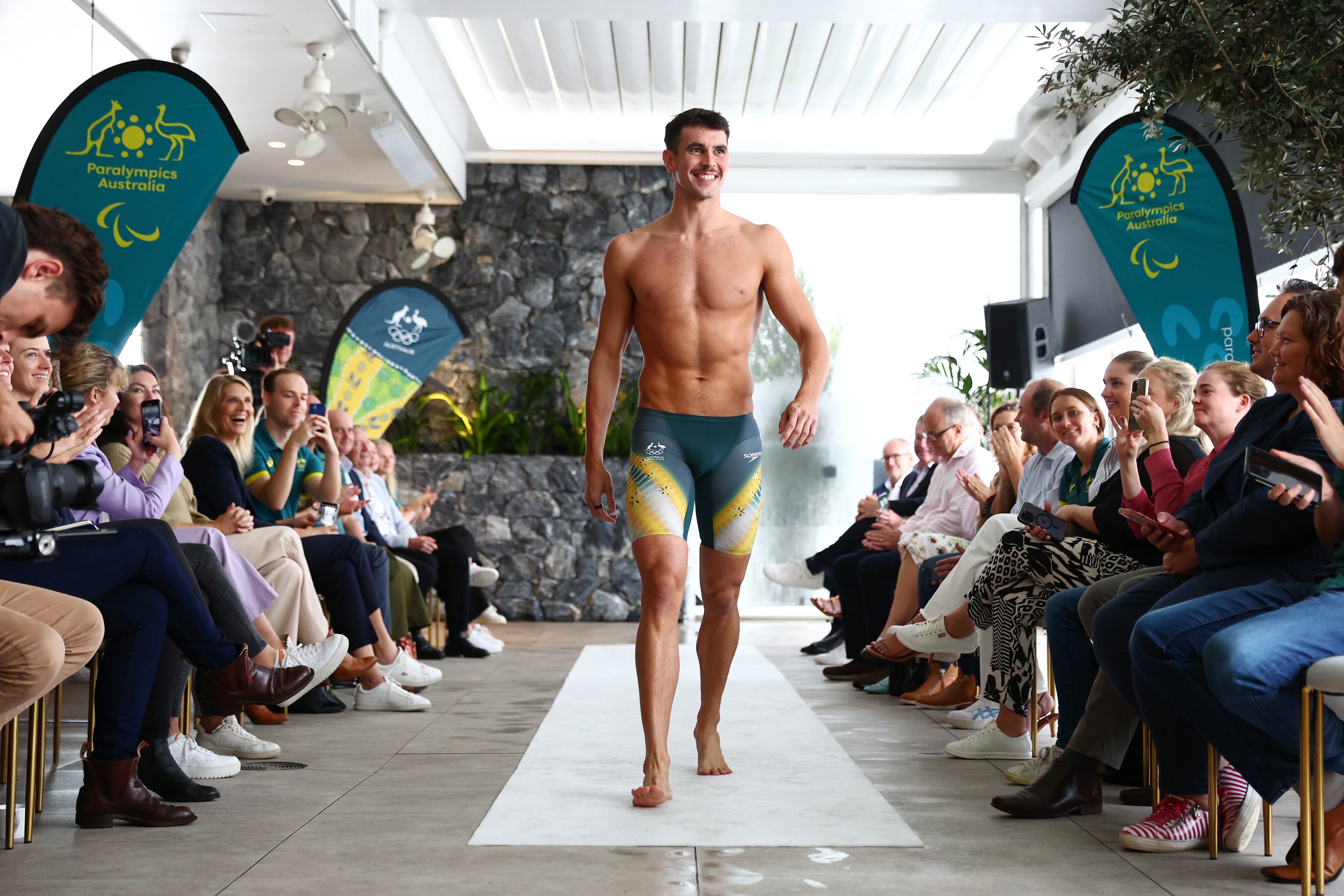 Tommy Neill, an Australian swimmer, models the uniform for the Paris Olympic Games