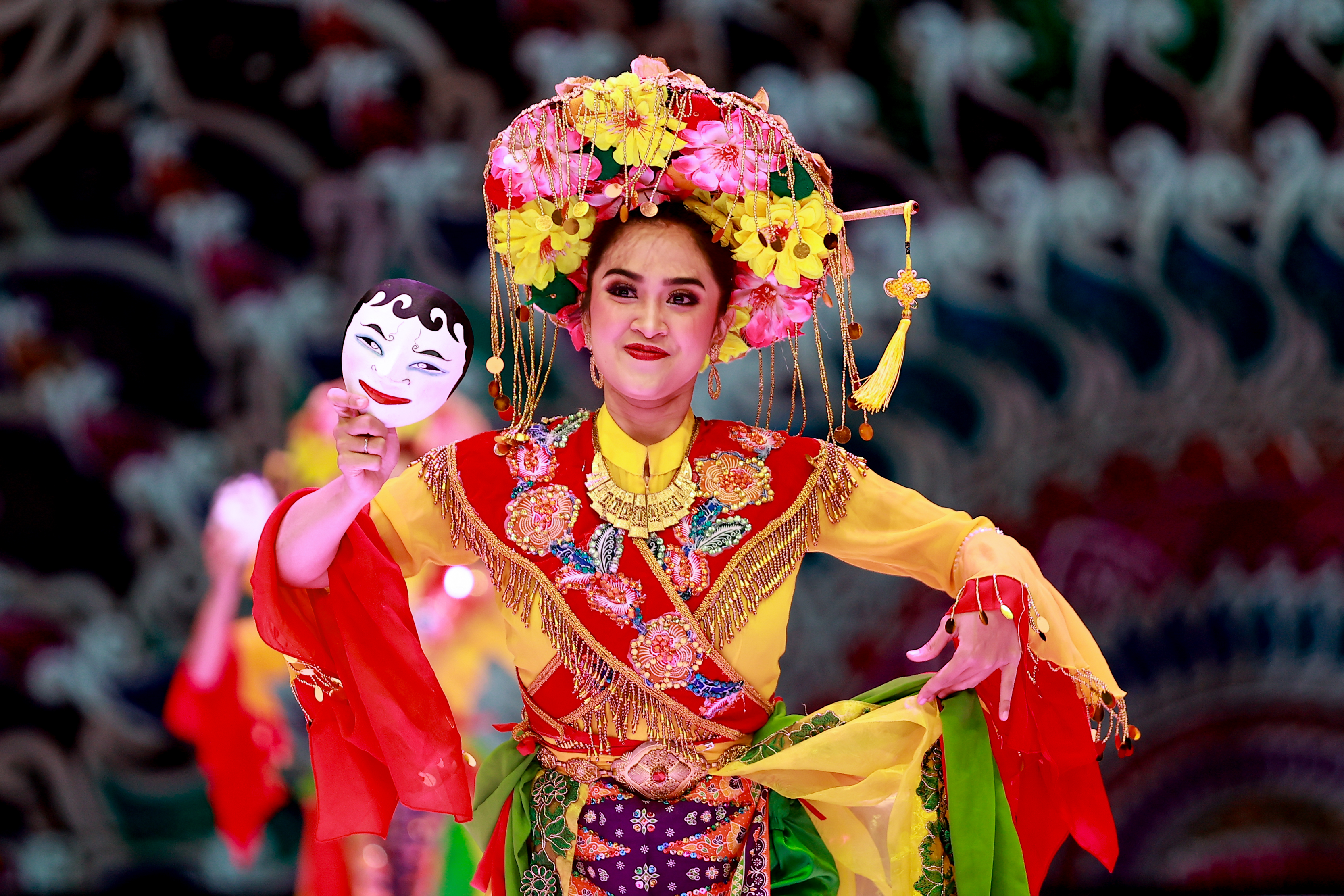 D’Jakfaro dancers perform the traditional Betawi Topeng dance, which is used for the telling of ancient stories, during Indonesia Fashion Week 2024. The mask is used for playing the messengers of gods