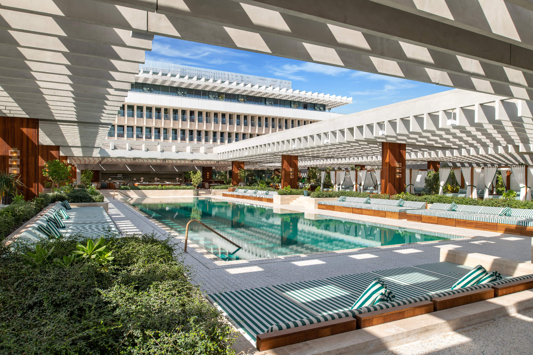 The super-chic pool area at the Ned Doha